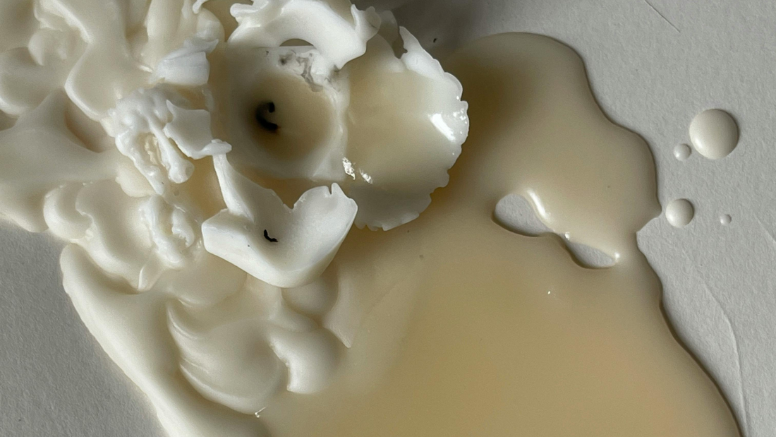 White candle melted on floor