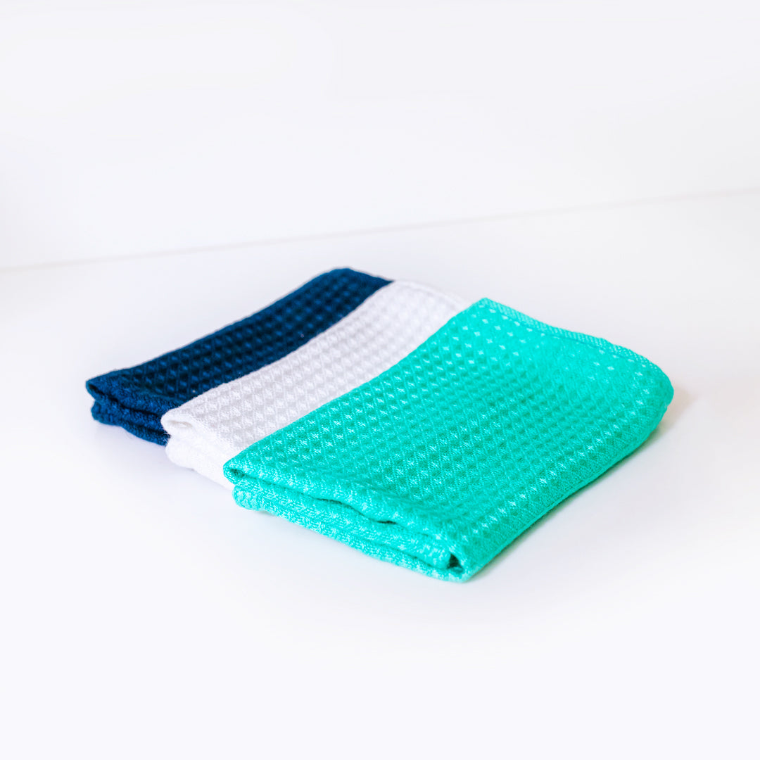 3 bamboo cloths laid out on white counter
