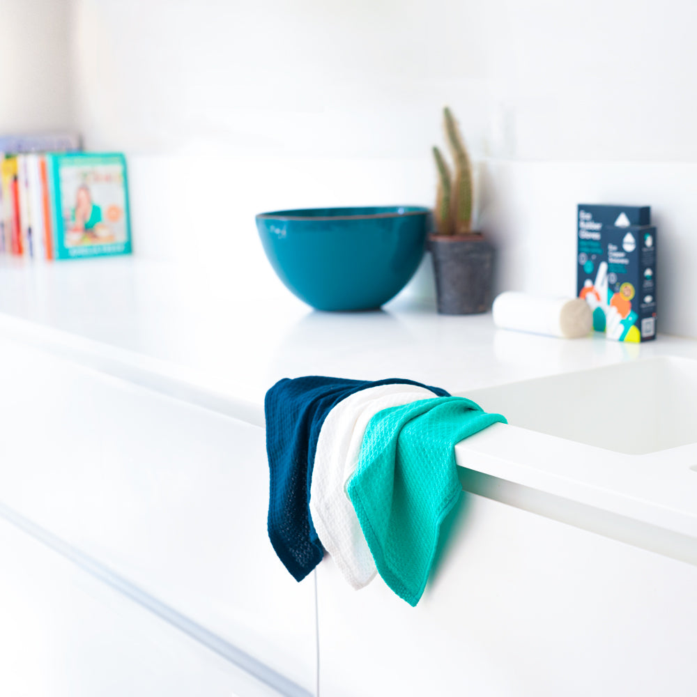 3 bamboo cloths hanging on kitchen sink