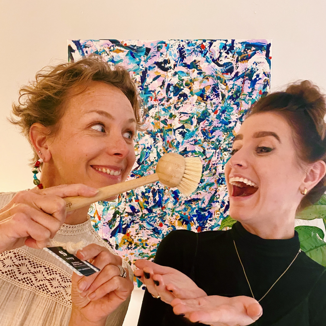 Laura and Mel holding bamboo dish brush