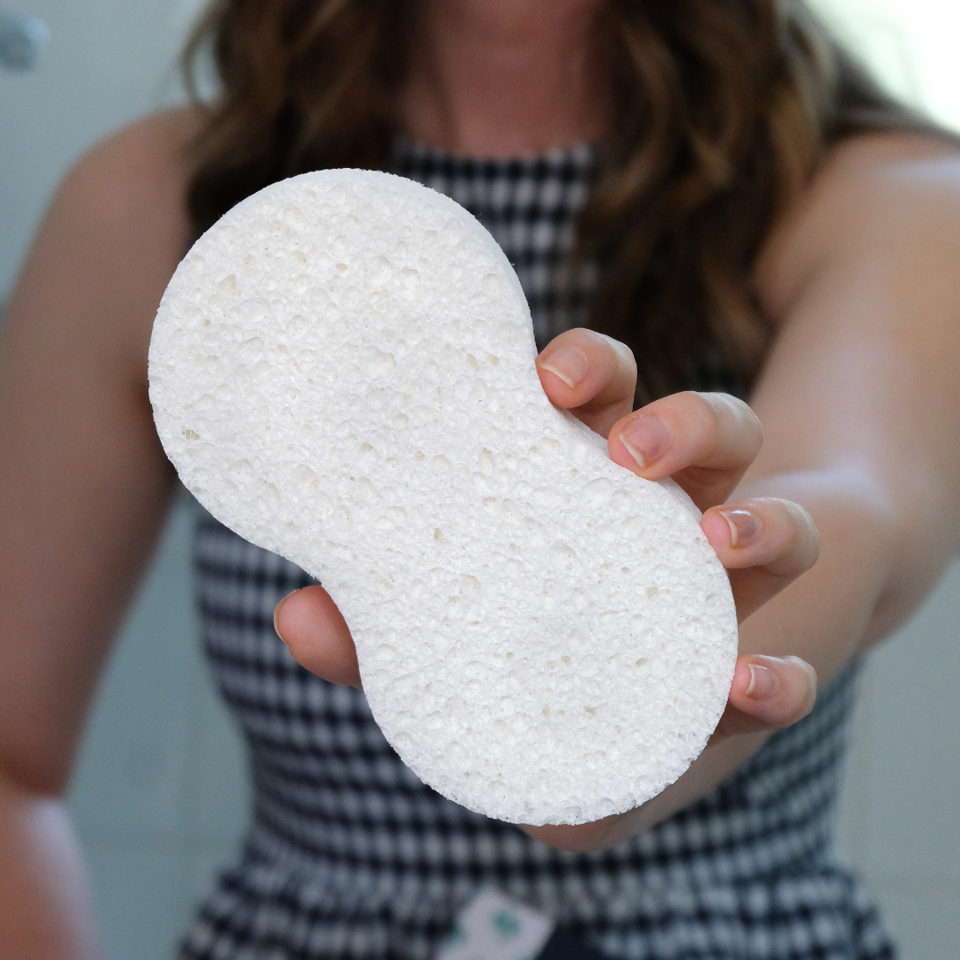 Woman holding Large Cellulose Sponge to camera